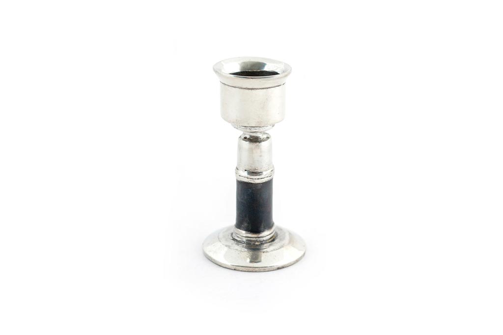 Hand made pewter taper holder with black band.  Stands 3" high. Fairly Traded.