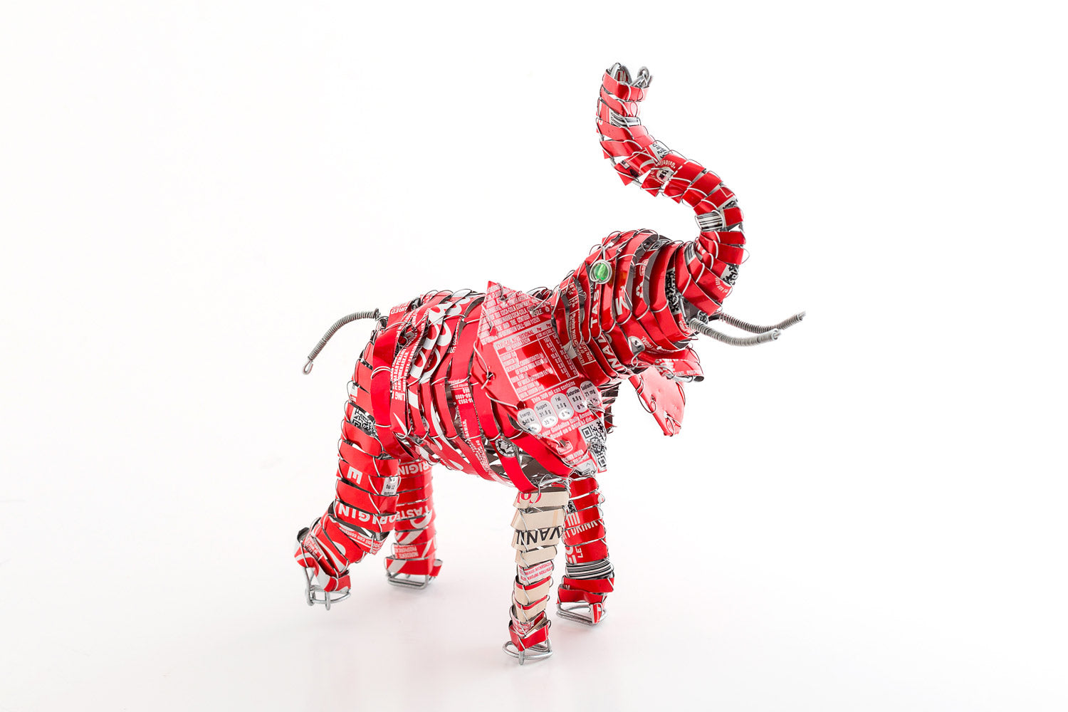 Happy elephant with his truck 'up' made from recycled Coke tins. Approx. 8" tall.  Hand made in South Africa.