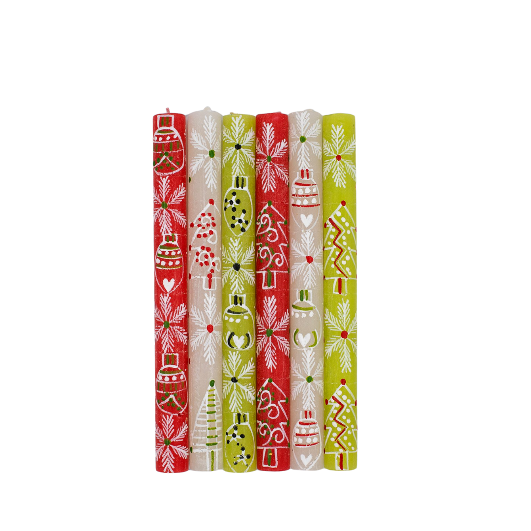 Whimsy Christmas Taper Candles; base candles are red, white & green, each hand painted with 'whimsy' Christmas designs such as snow flakes, trees, and ornaments in white with accent colors of red and green. Very fun and different! 