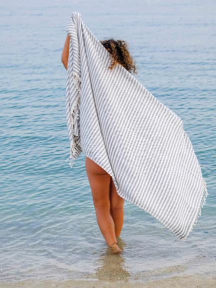 Little girl at the beach with a lovely blue & white Turkish Towel! Fair Trade Home Decor