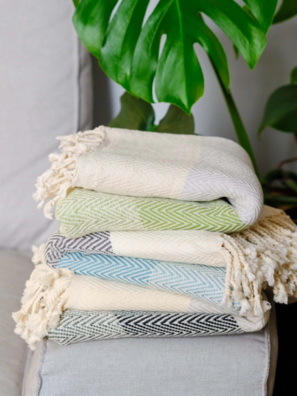 Beautiful stack of striped Turkish Towels, cream and lime green; cream, turquoise & cream; grey, black and cream. Cream fringe. Folded in stack.   